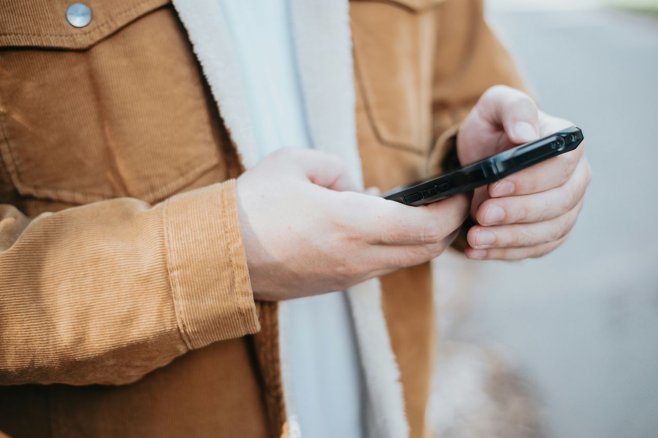 Customer sending a message to a business on a smartphone