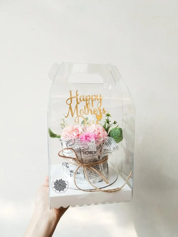 A gift box finished with a greeting topper